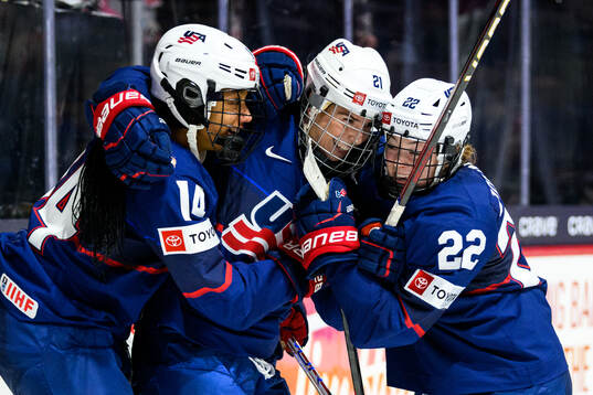 Hilary Knight of USA celebrates with teammates