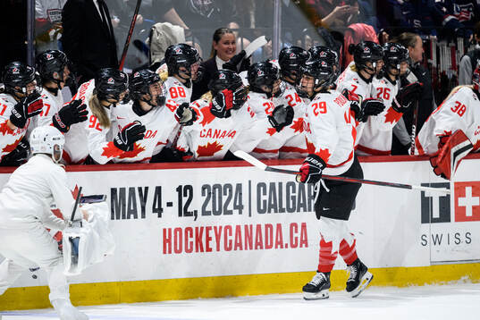 Marie-Philip Poulin of Canada celebrates scoring 4-5