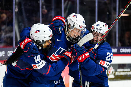 Hilary Knight of USA celebrates with teammates