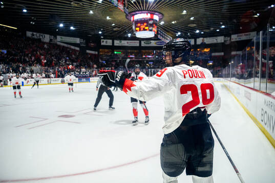 Marie-Philip Poulin of Canada celebrates scoring 3-3
