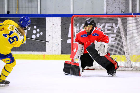 Matilda Österman of Sweden and Goalkeeper Amaya Iseli of