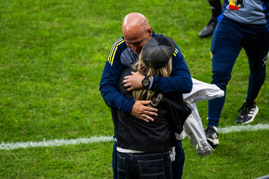 Assistant coach Magnus Wikman celebrates with team manager
