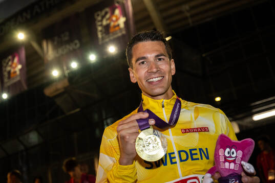 Perseus Karlström of Sweden celebrates with his gold medal