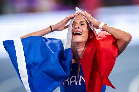 Alice Finot of France celebrates