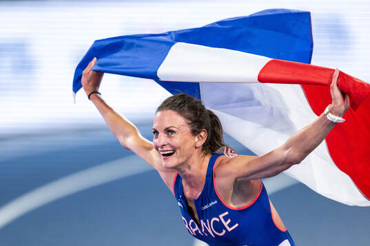 Alice Finot of France celebrates