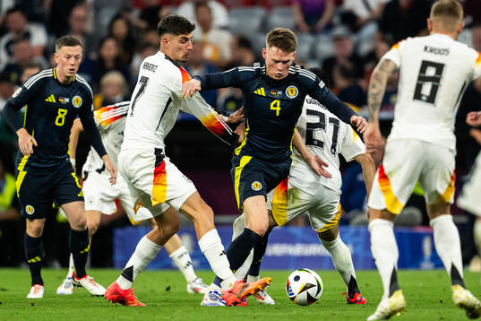 Kai Havertz of Germany and Scott McTominay of Scotland