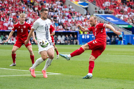 Timi Elsnik of Slovenia and Christian Eriksen of Denmark