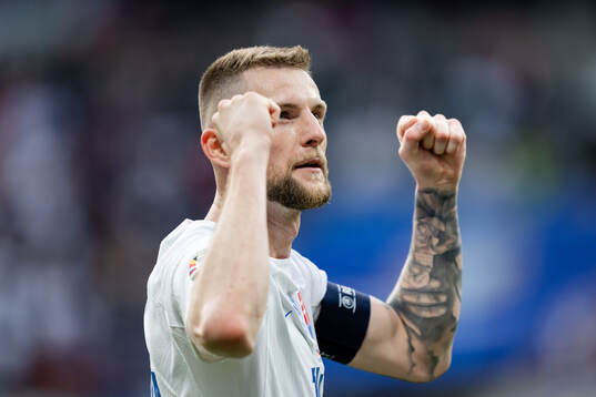 Milan Skriniar of Slovakia celebrates