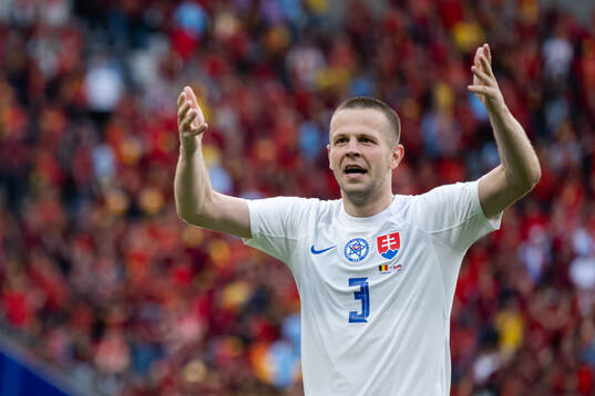 Denis Vavro of Slovakia celebrates