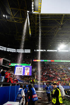 General view as rain falls inside the stadium
