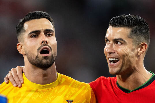 Diogo Costa and Cristiano Ronaldo of Portugal