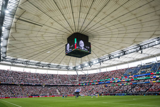 Players of Denmark and of England honouring the memory of
