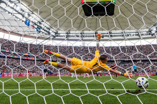 Morten Hjulmand of Denmark (not pictured) scores 1-1 behind