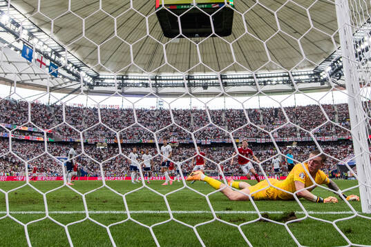 Goalkeeper Jordan Pickford of England looks dejected