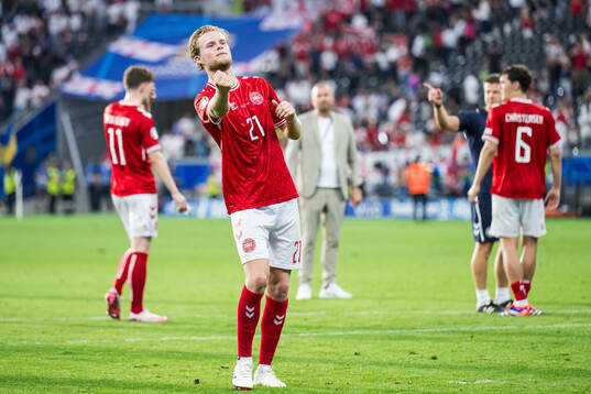 Morten Hjulmand of Denmark celebrates