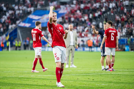 Morten Hjulmand of Denmark celebrates
