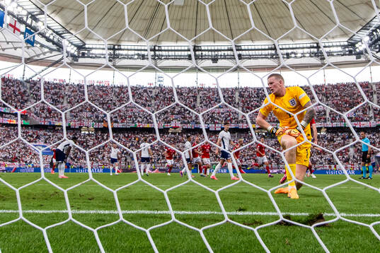Goalkeeper Jordan Pickford of England looks dejected