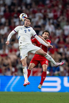 Dusan Vlahovic of Serbia and Thomas Delaney of Denmark