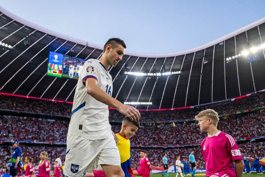 Srdan Mijailovic of Serbia enters the pitch