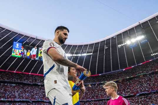 Aleksandar Mitrovic of Serbia enters the pitch