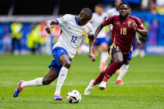 Randal Kolo Muani of France and Orel Mangala of Belgium