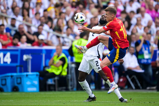 Antonio Ruediger of Germany and Daniel Olmo of Spain