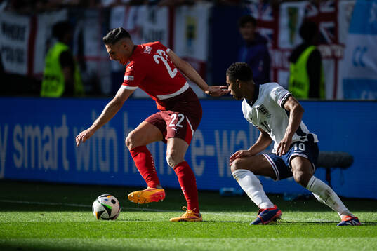 Fabian Schär of Switzerland and Jude Bellingham of England
