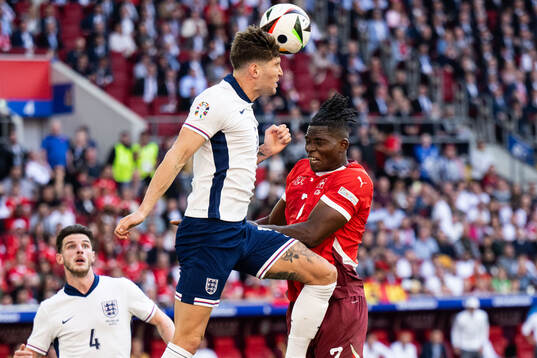 John Stones of England and Breel Embolo of Switzerland