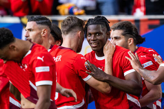 Breel Embolo of Switzerland celebrates with team mates