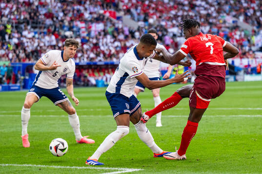 Ezri Konsa of England and Breel Embolo of Switzerland