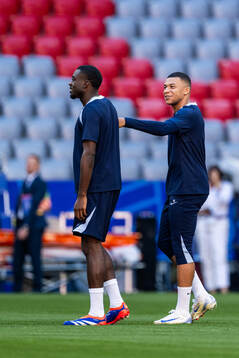 Youssouf Fofana and Kylian Mbappé at a training session