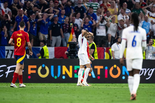 Kylian Mbappé of France looks dejected
