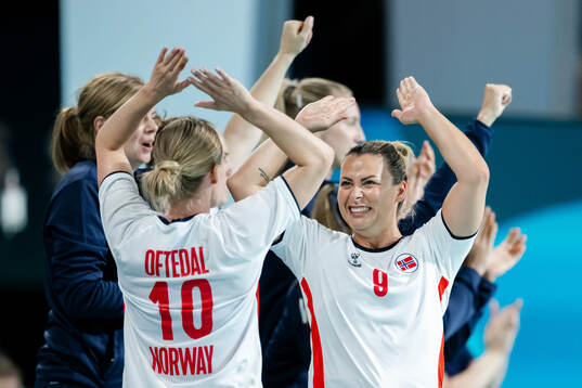 Stine Bredal Oftedal and Nora Mørk of Norway celebrate in