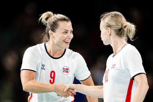 Stine Bredal Oftedal and Nora Mørk of Norway celebrate
