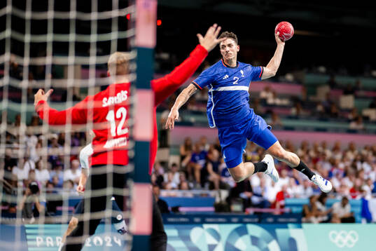 Goalkeeper Kristian Sæverås of Norway and Yanis Lenne of