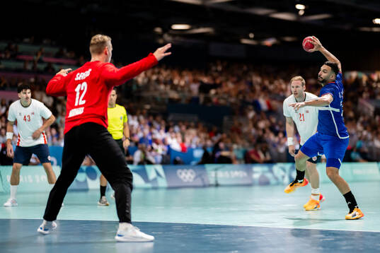 Hugo Descat of France and goalkeeper Kristian Sæverås of