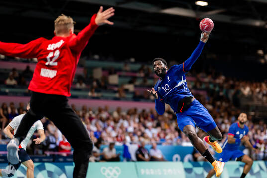Goalkeeper Kristian Sæverås of Norway and Dika Mem of