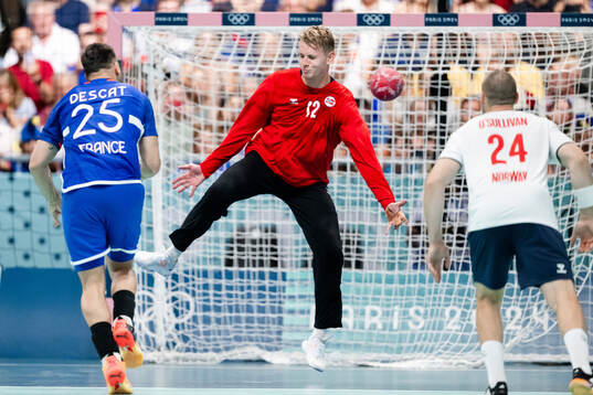 Goalkeeper Kristian Sæverås of Norway against Hugo Descat