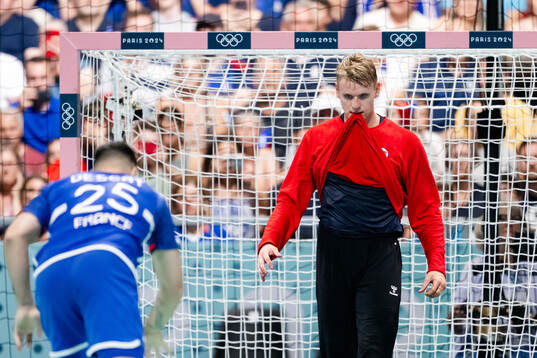 Hugo Descat of France and goalkeeper Kristian Sæverås of