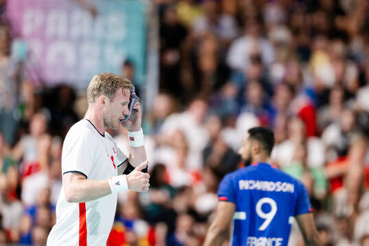 Magnus Gullerud of Norway in pain in a men's preliminary