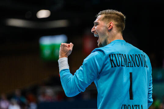 Goalkeeper Dominik Kuzmanovic of Croatia celebrates in a