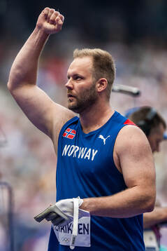 Eivind Henriksen of Norway celebrates when competing in