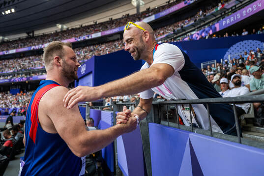 Eivind Henriksen of Norway celebrates with coach Paul