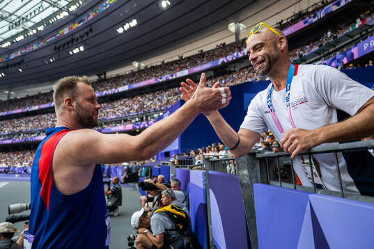 Eivind Henriksen of Norway celebrates with coach Paul