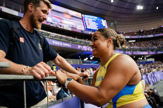 Vanessa Kamga of Sweden celebrates with coach Mats Olsson