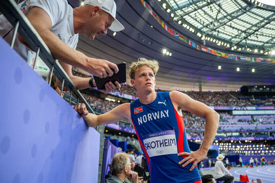 Sander Skotheim of Norway with his coach Eirik Roe while