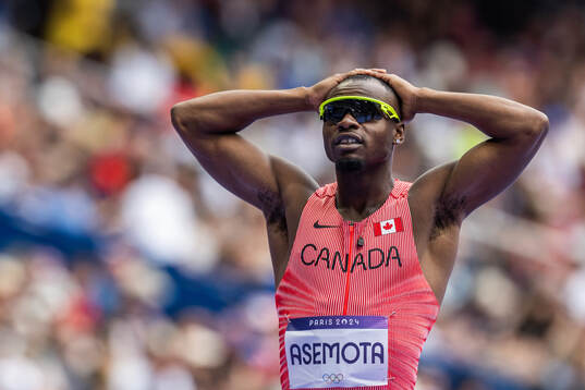 Duan Asemota of Canada looks dejected