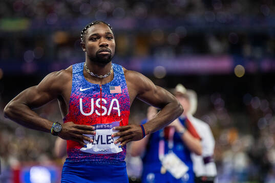 Noah Lyles of USA celebrates