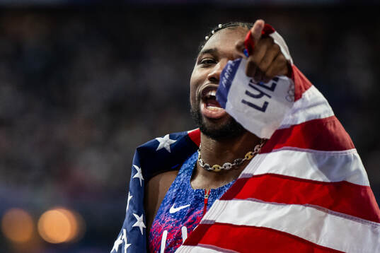 Noah Lyles of USA celebrates