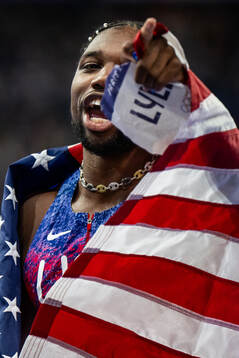 Noah Lyles of USA celebrates